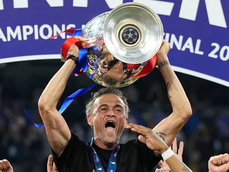 PSG's head coach Luis Enrique holds up the trophy as he celebrates with his players after winning the Champions League final soccer match between Paris Saint-Germain and Inter Milan at the Allianz Arena in Munich, Germany, Saturday, May 31, 2025. (AP Photo/Martin Meissner)

- XCHAMPIONSLEAGUEX