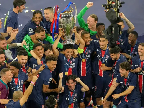 PSG's Marquinhos celebrates with the trophy after winning the Champions League final soccer match between Paris Saint-Germain and Inter Milan at the Allianz Arena in Munich, Germany, Saturday, May 31, 2025. (AP Photo/Michael Probst)

- XCHAMPIONSLEAGUEX