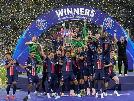 PSG players celebrate with the trophy after winning the Champions League final soccer match between Paris Saint-Germain and Inter Milan at the Allianz Arena in Munich, Germany, Saturday, May 31, 2025. (AP Photo/Matthias Schrader)

- XCHAMPIONSLEAGUEX