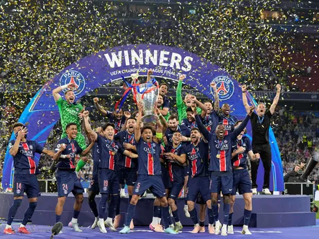 PSG's Marquinhos holds up the trophy as he celebrates with his teammates after winning the Champions League final soccer match between Paris Saint-Germain and Inter Milan at the Allianz Arena in Munich, Germany, Saturday, May 31, 2025. (AP Photo/Martin Meissner)

- XCHAMPIONSLEAGUEX