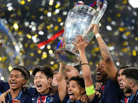 PSG's team captain Marquinhos lifts the trophy after winning the Champions League final soccer match between Paris Saint-Germain and Inter Milan at the Allianz Arena in Munich, Germany, Saturday, May 31, 2025. (AP Photo/Luca Bruno)

- XCHAMPIONSLEAGUEX