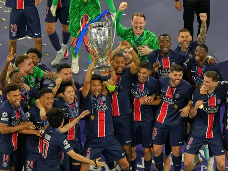 PSG's Marquinhos celebrates with the trophy after winning the Champions League final soccer match between Paris Saint-Germain and Inter Milan at the Allianz Arena in Munich, Germany, Saturday, May 31, 2025. (AP Photo/Michael Probst)

- XCHAMPIONSLEAGUEX