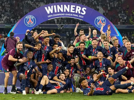 Paris Saint-Germain players pose for a photo with the trophy as they celebrate winning the Champions League final soccer match against Inter Milan at the Allianz Arena in Munich, Germany, Saturday, May 31, 2025. (AP Photo/Martin Meissner)

- XCHAMPIONSLEAGUEX