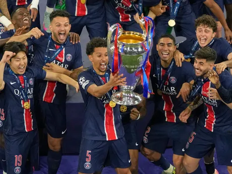 PSG's Marquinhos celebrates with the trophy after winning the Champions League final soccer match between Paris Saint-Germain and Inter Milan at the Allianz Arena in Munich, Germany, Saturday, May 31, 2025. (AP Photo/Michael Probst)

- XCHAMPIONSLEAGUEX