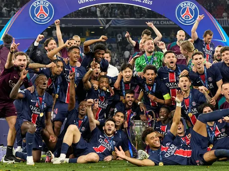 Paris Saint-Germain players pose for a photo with the trophy as they celebrate winning the Champions League final soccer match against Inter Milan at the Allianz Arena in Munich, Germany, Saturday, May 31, 2025. (AP Photo/Martin Meissner)

- XCHAMPIONSLEAGUEX