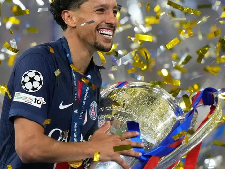 PSG's team captain Marquinhos holds the trophy after winning the Champions League final soccer match between Paris Saint-Germain and Inter Milan at the Allianz Arena in Munich, Germany, Saturday, May 31, 2025. (AP Photo/Luca Bruno)

- XCHAMPIONSLEAGUEX