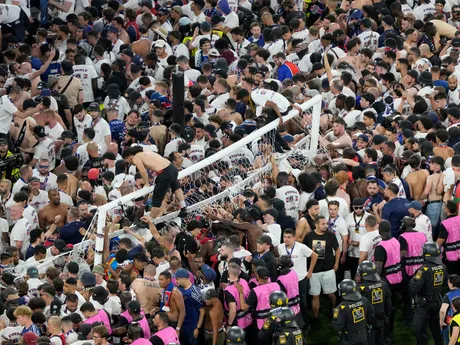Fans of PSG invade the pitch after the Champions League final soccer match between Paris Saint-Germain and Inter Milan at the Allianz Arena in Munich, Germany, Saturday, May 31, 2025. (AP Photo/Michael Probst)

- XCHAMPIONSLEAGUEX