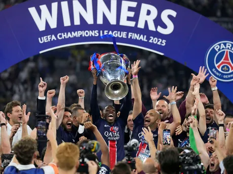 PSG players celebrate with the trophy after winning the Champions League final soccer match between Paris Saint-Germain and Inter Milan at the Allianz Arena in Munich, Germany, Saturday, May 31, 2025. (AP Photo/Matthias Schrader)

- XCHAMPIONSLEAGUEX