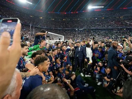 PSG players pose for a photo with the Champions League trophy after their win in the final soccer match against Inter Milan at the Allianz Arena in Munich, Germany, Saturday, May 31, 2025. (AP Photo/Martin Meissner)

- XCHAMPIONSLEAGUEX