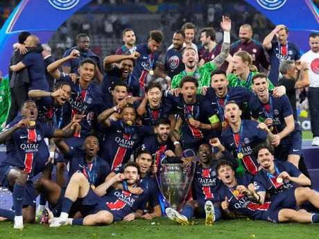PSG players celebrate with the trophy after winning the Champions League final soccer match between Paris Saint-Germain and Inter Milan at the Allianz Arena in Munich, Germany, Saturday, May 31, 2025. (AP Photo/Matthias Schrader)

- XCHAMPIONSLEAGUEX