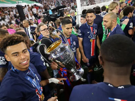 PSG players celebrate with a trophy after the Champions League final soccer match between Paris Saint-Germain and Inter Milan at the Allianz Arena in Munich, Germany, Saturday, May 31, 2025. (AP Photo/Alexandra Beier)

- XCHAMPIONSLEAGUEX