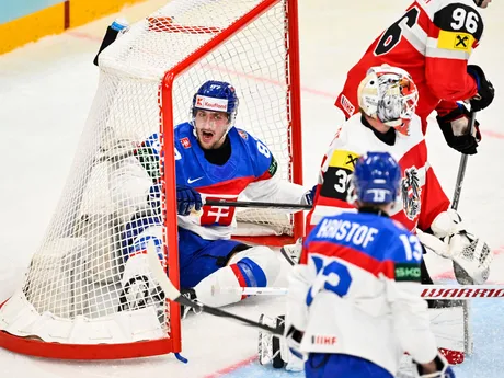 Slovakia's Pavol Regenda, left, sits in the goal behind Austria's goalkeeper David Kickert during the IIHF Ice Hockey World Championship group A match between Austria and Slovakia at Avicii Arena in Stockholm, Sweden, Monday, May 12, 2025. (Anders Wiklund/TT News Agency via AP)

- group stage;Austria;Ice Hockey World Championship;World Cup;Slovakia;ice hockey