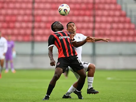 Na snímke vľavo hráč Trnavy Philip Azango a hráč Hibernians Pablo Alves počas odvetného zápasu 2. predkola Konferenčnej ligy FC Spartak Trnava - FC Hibernians Paola.