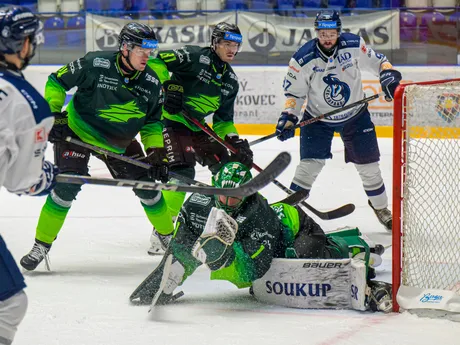 Na snímke zľava Marek Korenčik, Erik Rajnoha, dole Connor James Lacouvée (všetci Žilina), Jeremy Robert Bracco (Poprad) počas zápasu 16. kola hokejovej Tipsport extraligy HK Poprad - Vlci Žilina.