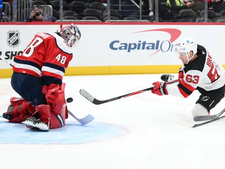 Washington Capitals goaltender Logan Thompson (48) stops a shot by New Jersey Devils left wing Jesper Bratt (63) during the second period of an NHL hockey game, Saturday, Nov. 15, 2025, in Washington. (AP Photo/Nick Wass)