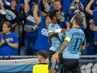 Na snímke gólová radosť Slovanistov, sprava Tigran Barseghjan, Sandro Cruz počas prvého zápasu play off Ligy majstrov vo futbale ŠK Slovan Bratislava - NK Celje.