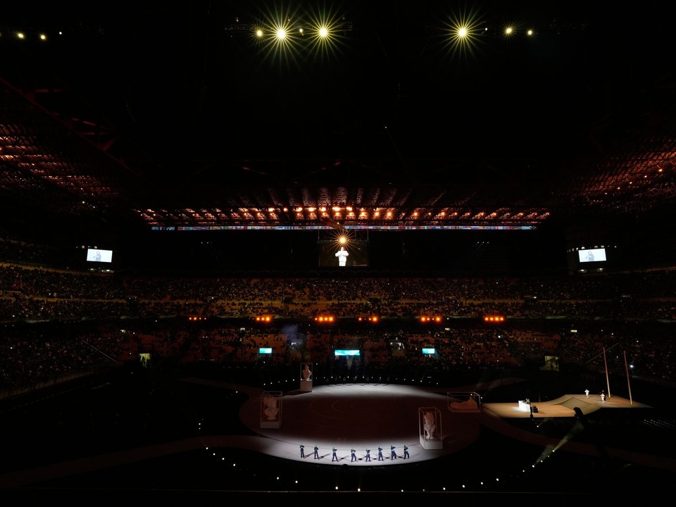 Spectators watch a pre-show ahead of the Olympic opening ceremony at the 2026 Winter Olympics, in Milan, Italy, Friday, Feb. 6, 2026. (AP Photo/Hassan Ammar)

- 2026 Winter Olympic Games;Winter Olympic games;Olympic games;Sports;Events;XXV Olympiad;Olympics 2026;Milan Cortina Olympics;Winter Olympics 2026;Milan Cortina Winter Olympics;2026 Milan Cortina Olympic Games;Olympics;Winter Games