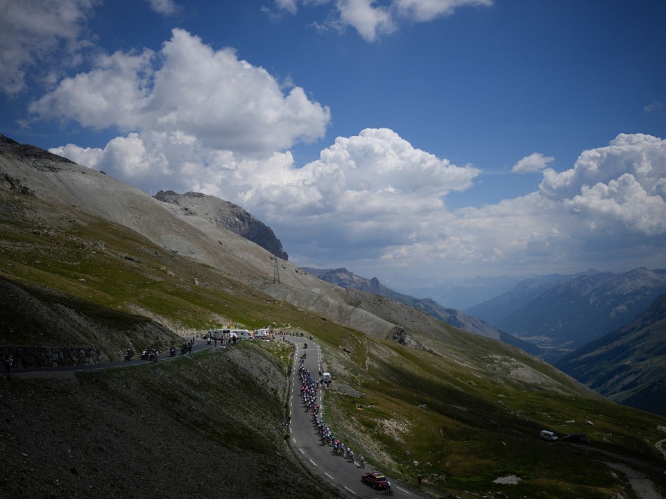FILE - The pack climbs Col du Galibier pass during the twelfth stage of the Tour de France cycling race over 165.5 kilometers (102.8 miles) with start in Briancon and finish in Alpe d'Huez, France, Thursday, July 14, 2022. (AP Photo/Daniel Cole, File)