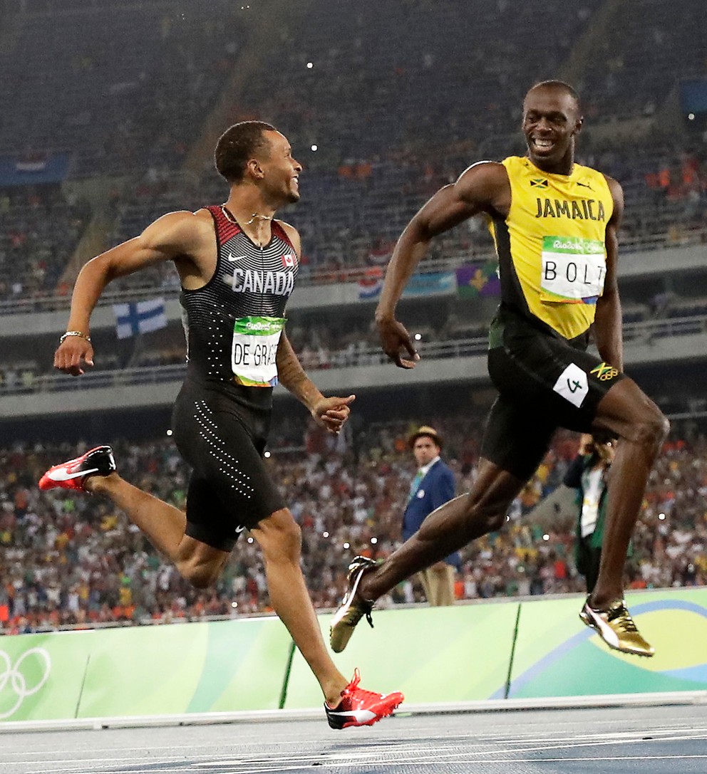 Beh na 200 metrov, semifinále. Úsmevy Kanaďana Andreho De Grasseho (vľavo) a Jamajčana Usaina Bolta. 