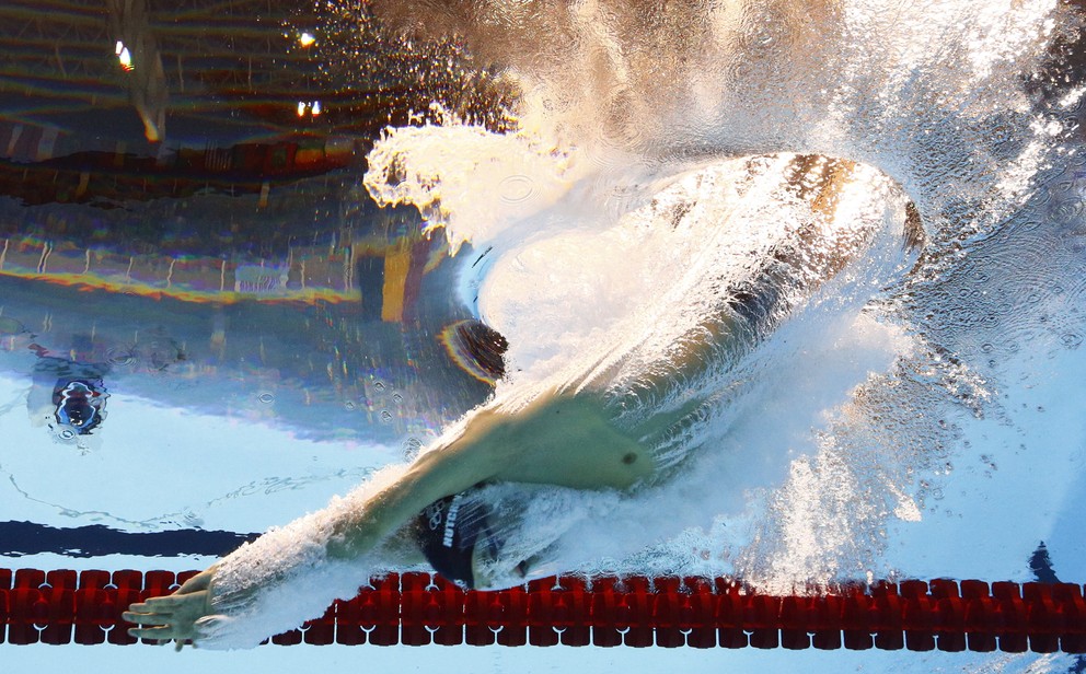 Plávanie, štart pretekov na 1500 metrov voľným spôsobom, Oussama Mellouli z Tuniska.