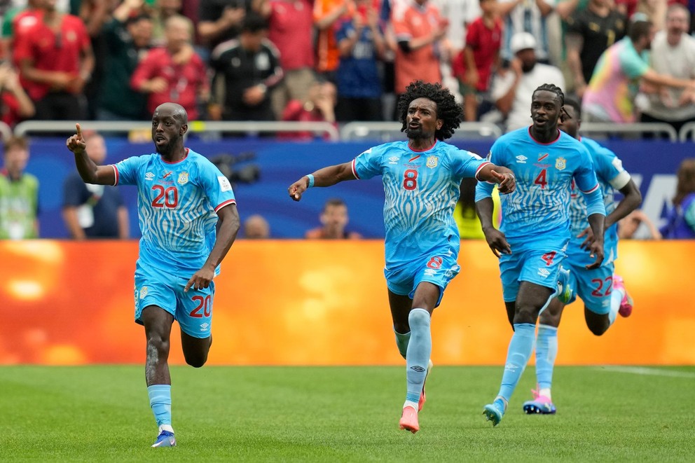   Congolese player Yoane Wissa (left) celebrates after scoring the opening goal.